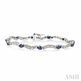 Commendable Combinations 4x3 MM Oval Cut Sapphire and 1/10 ctw Single Cut Diamond Bracelet in 14K White Gold