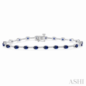 Formal Attire 4x3 MM Oval Cut Sapphire and 1/3 Ctw Round Cut Diamond Precious Bracelet in 10K White Gold