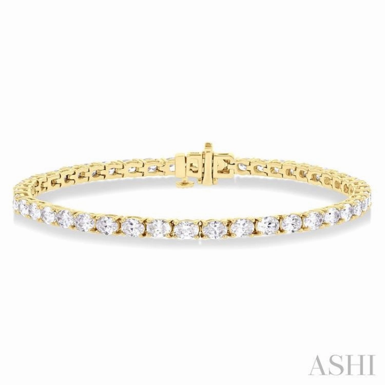 5 1/2 ctw East West Oval Cut Diamond Fashion Tennis bracelet in 14K Yellow Gold Personal Story