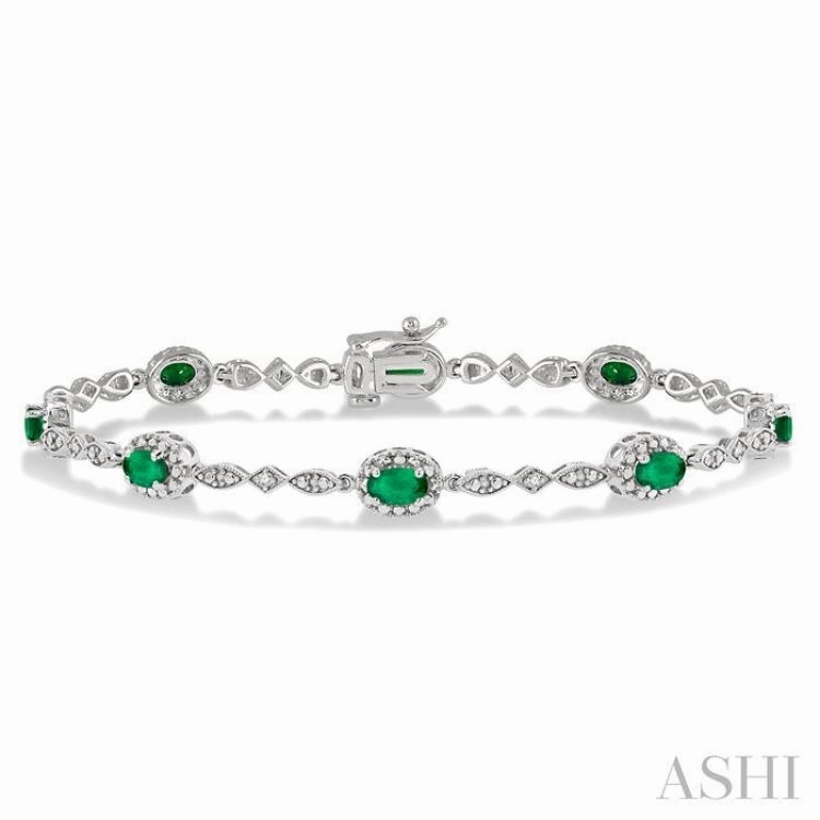 5x3 MM Oval Cut Emerald and 1/20 Ctw Single Cut Diamond Bracelet in 10K White Gold Tailored Touch