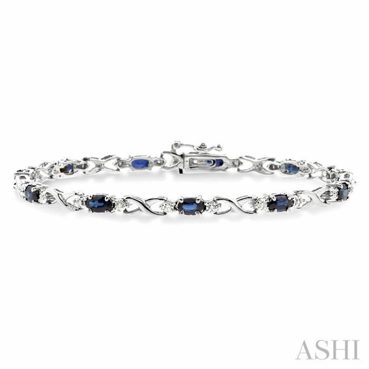 Quality Assurance 5x3 MM Oval Cut Sapphire and 1/10 ctw Single Cut Diamond Bracelet in 10K White Gold