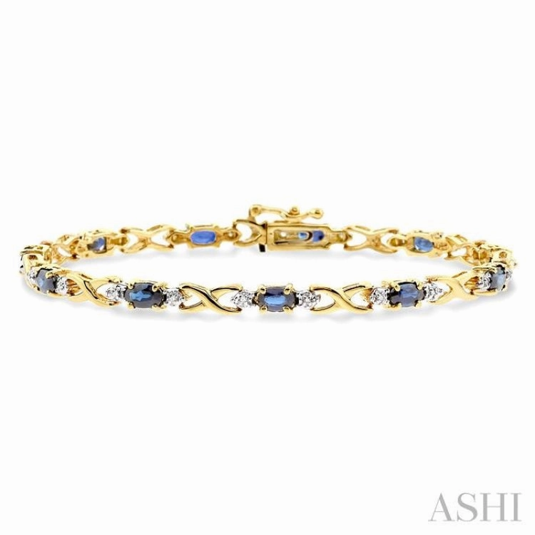 5x3 MM Oval Cut Sapphire and 1/10 ctw Single Cut Diamond Bracelet in 10K Yellow Gold Develop Character