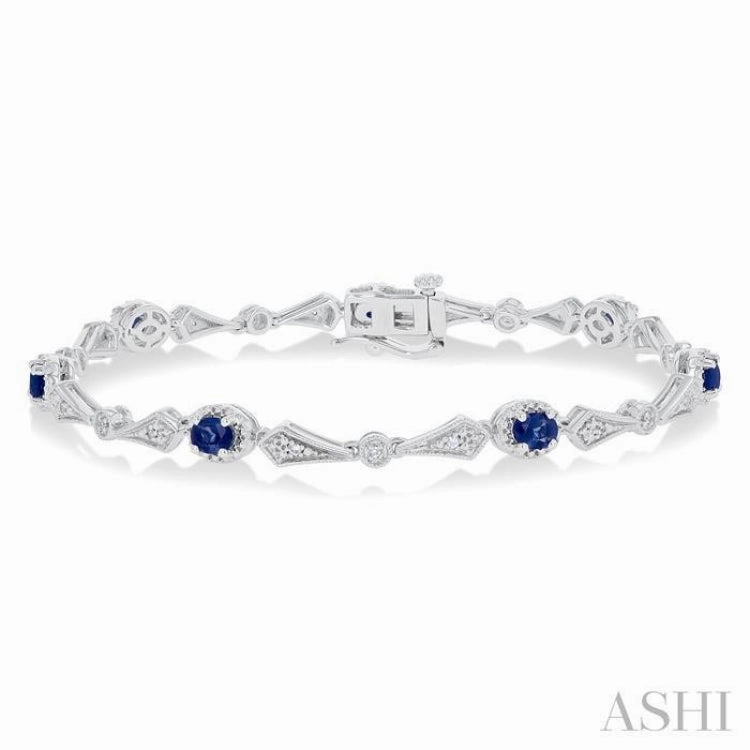 Go-To Item 4X3 MM Oval Cut Sapphire and 1/10 Ctw Round Cut Diamond Precious Bracelet in 10K White Gold
