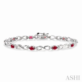 custom design Exclusive Touch 4x3 MM Oval Cut Ruby and 1/10 Ctw Single Cut Diamond Bracelet in 10K White Gold