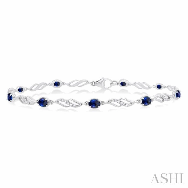 4X3 MM Oval Cut Sapphire and 1/5 Ctw Round Cut Diamond Precious Eternity Link Tennis Bracelet in 10K White Gold Stretchable Bands Distinct Perspective
