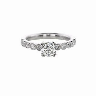 ROUND DIAMOND RING WITH BEZEL SET DIAMONDS DOWN THE SHANK (1.00cttw) Quality Expression