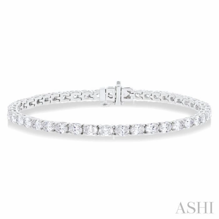 5 1/2 ctw East West Oval Cut Diamond Fashion Tennis bracelet in 14K White Gold Delightful Detail Rosy Outlook