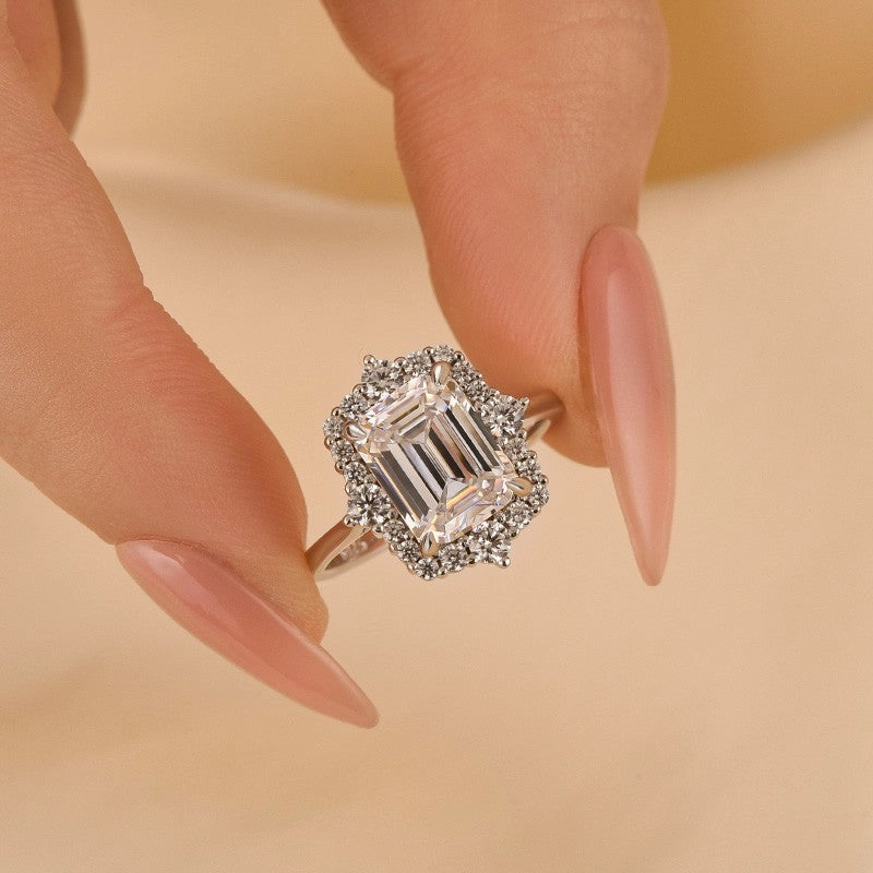 Sleek Outline Vintage 3.0Ct Halo Emerald Cut White Stone Engagement Ring In Sterling Silver
