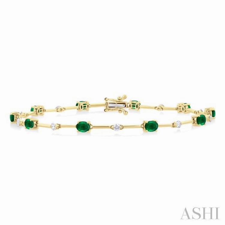 Now Showing 4x3 MM Oval Cut Emerald and 1/3 ctw Round Cut Diamond Precious Bar Bracelet in 10K Yellow Gold