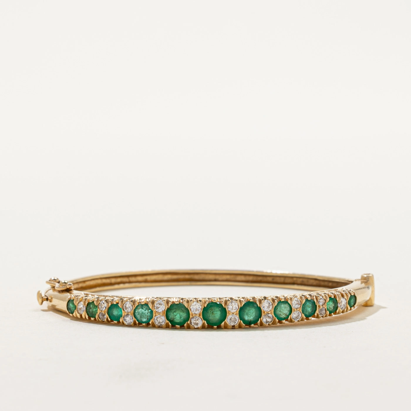 Captivating Accent Vintage Emerald & Diamond Bangle | 1.30ctw, 0.50ctw | 5"