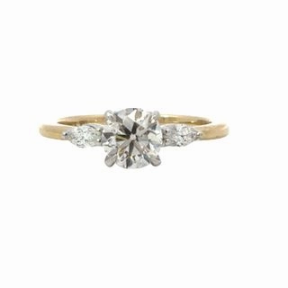 THREE STONE ROUND AND MARQUISE DIAMOND RING (1.20cttw) Coated Material